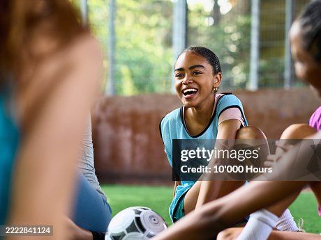 coach and athlete on the sideline, mid-conversation
