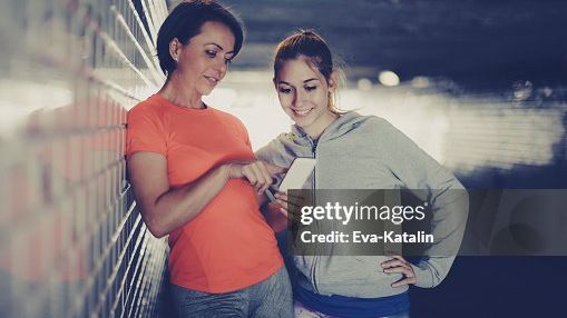 with a parent, phone between them