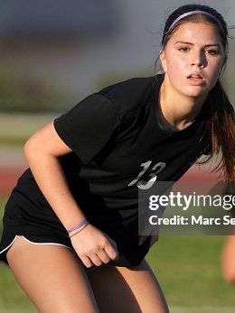 athlete mid-match, jaw set, working